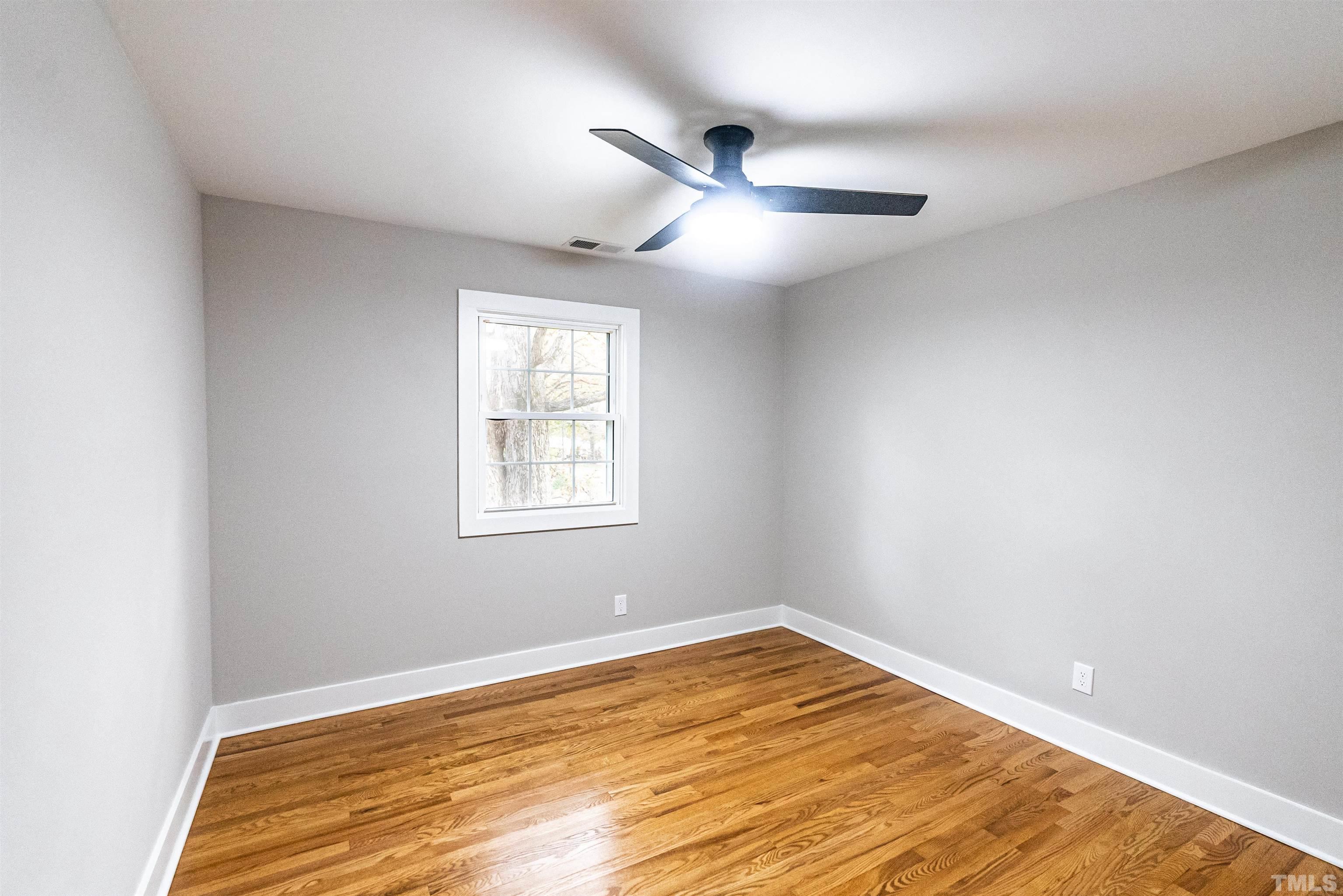5405 Emerson Drive Raleigh, NC 27609 - Photo 24 of 46 a view of empty room with wooden floor
