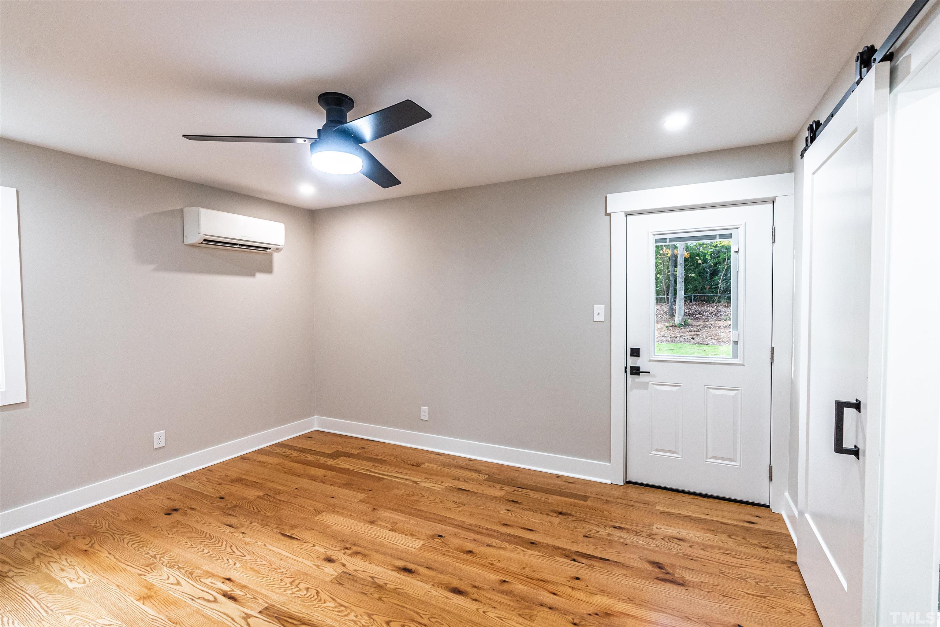 5405 Emerson Drive Raleigh, NC 27609 - Photo 28 of 46 a view of empty room with wooden floor and fan