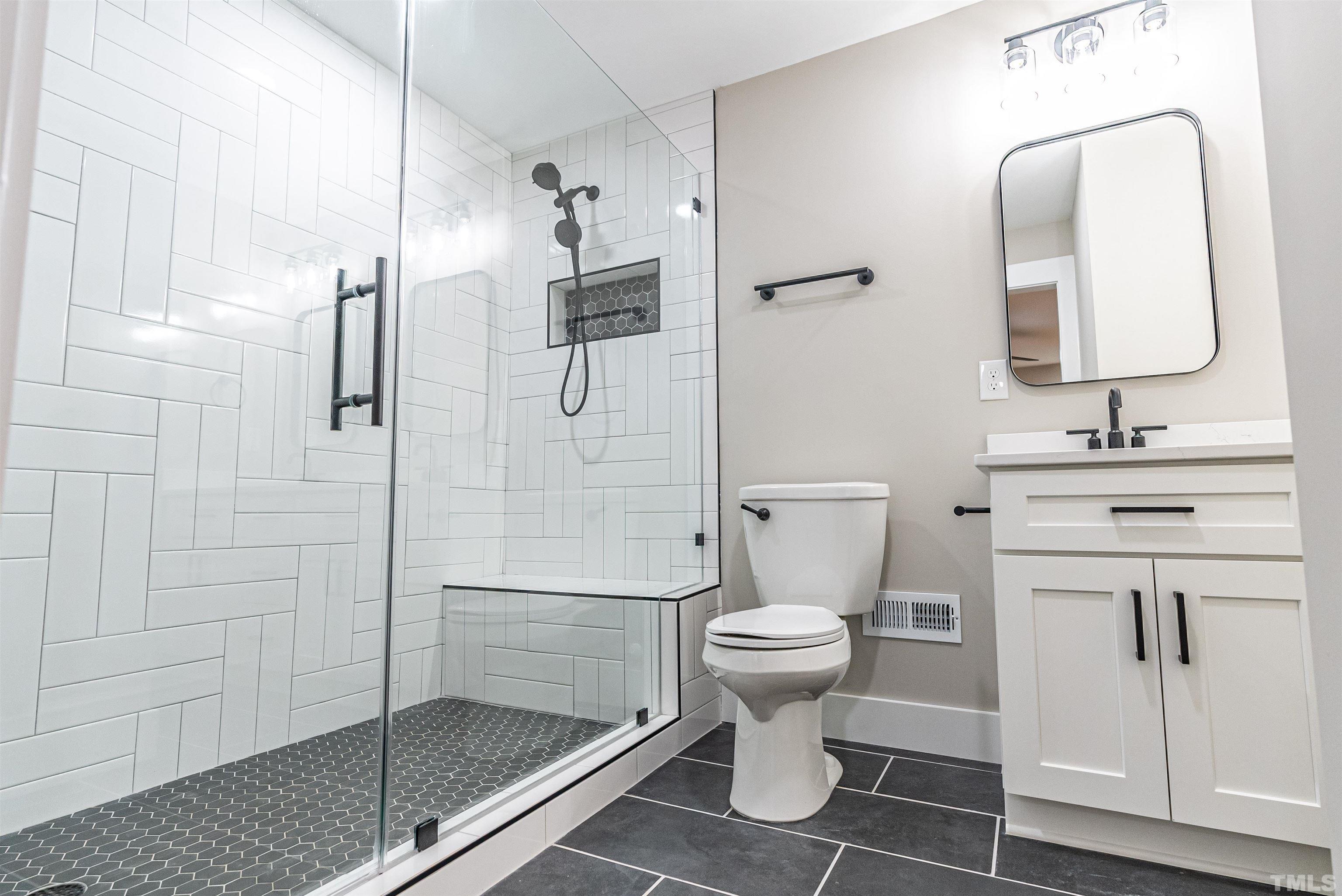 5405 Emerson Drive Raleigh, NC 27609 - Photo 30 of 46 a bathroom with a toilet sink and shower