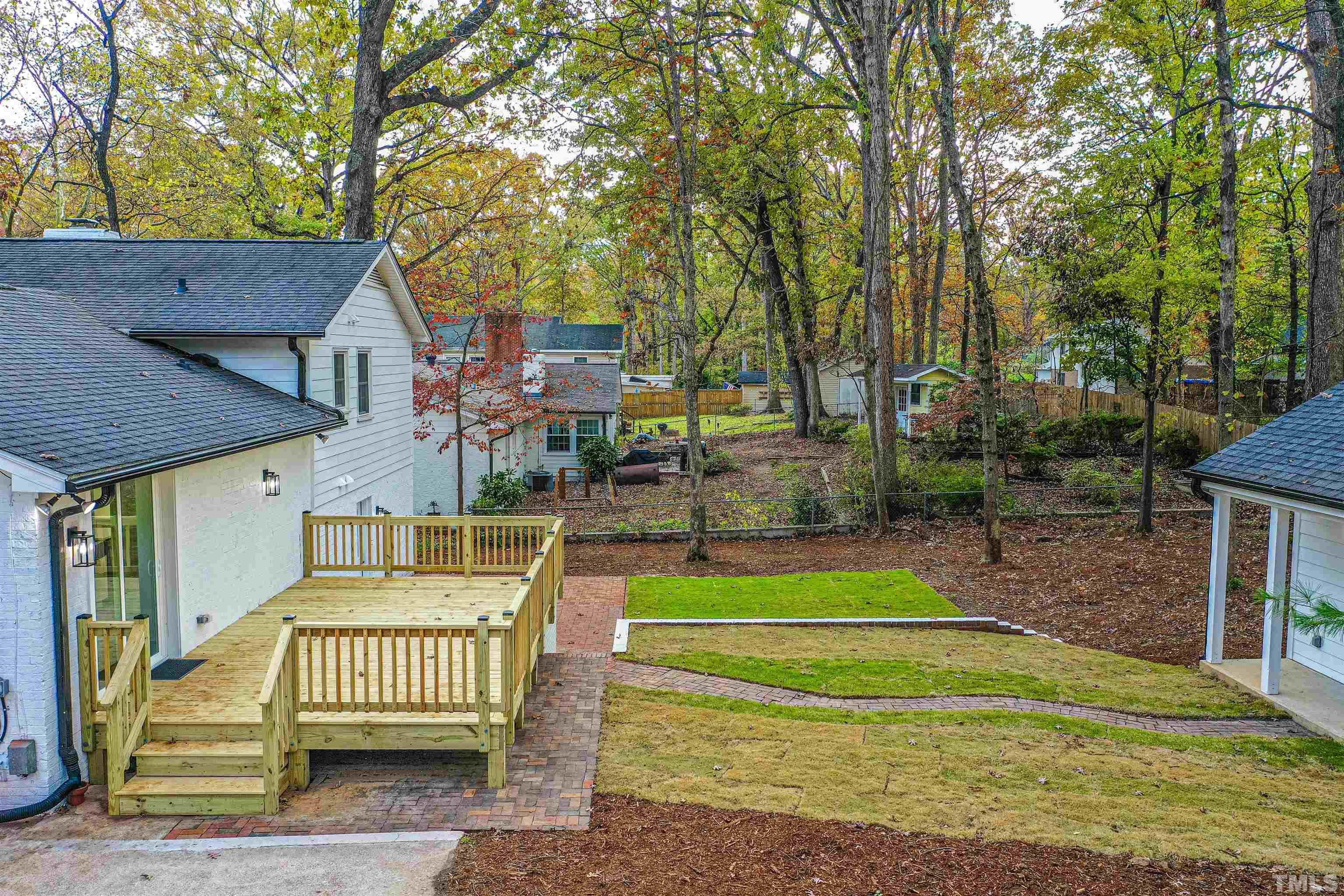 5405 Emerson Drive Raleigh, NC 27609 - Photo 38 of 46 a view of a house with a patio and a yard