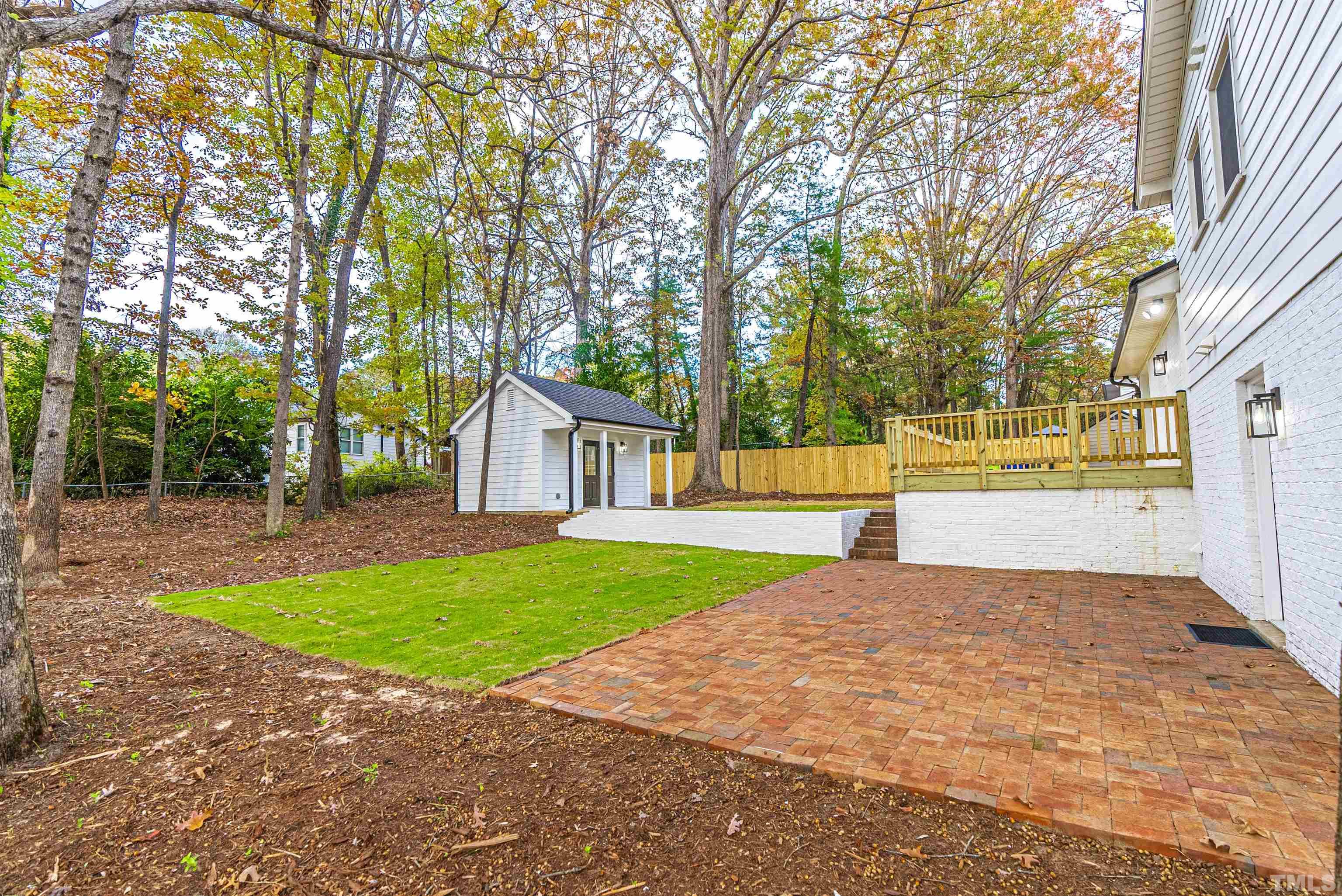 5405 Emerson Drive Raleigh, NC 27609 - Photo 40 of 46 a view of a house with a big yard and large trees