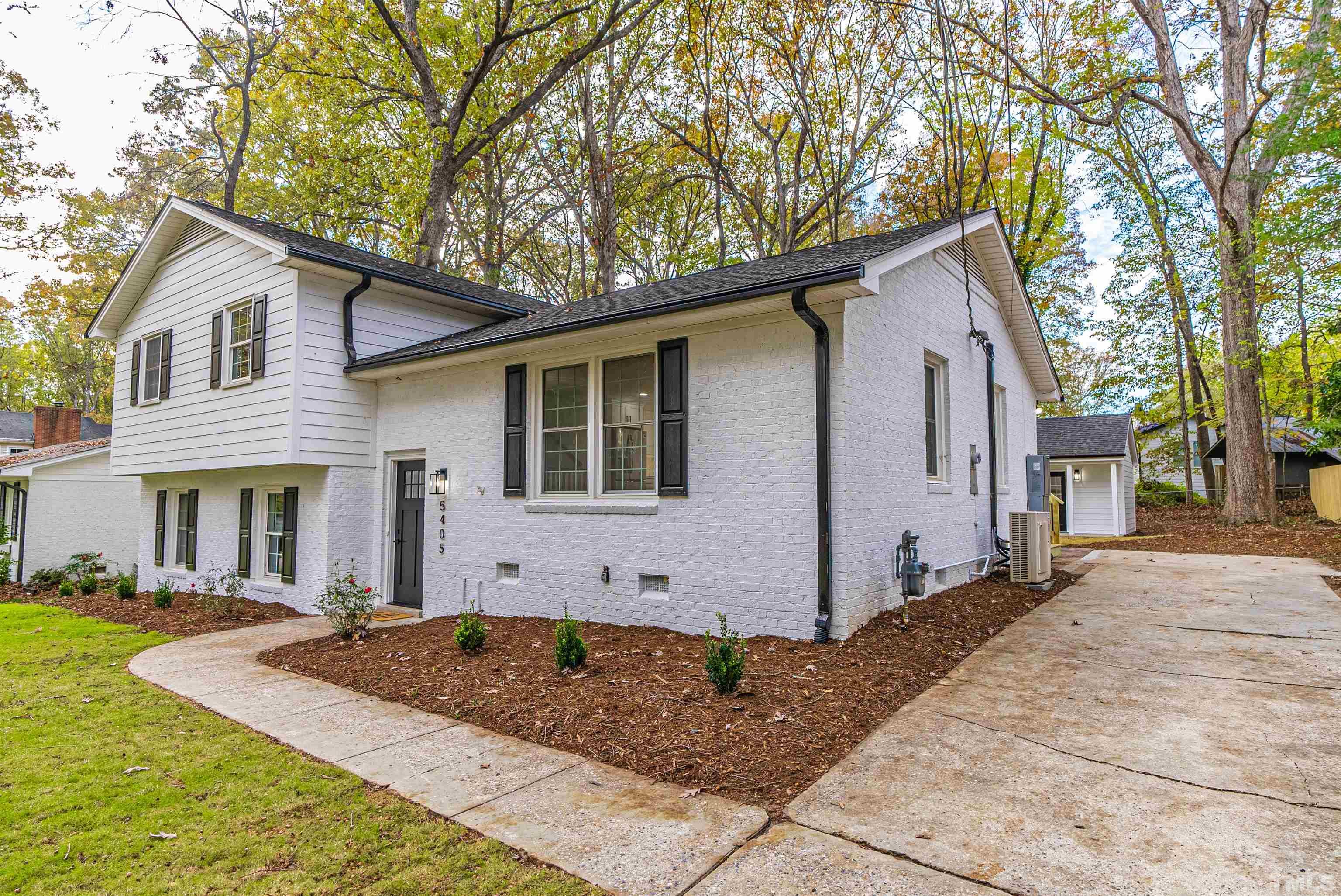 5405 Emerson Drive Raleigh, NC 27609 - Photo 4 of 46 a front view of house with yard and trees around