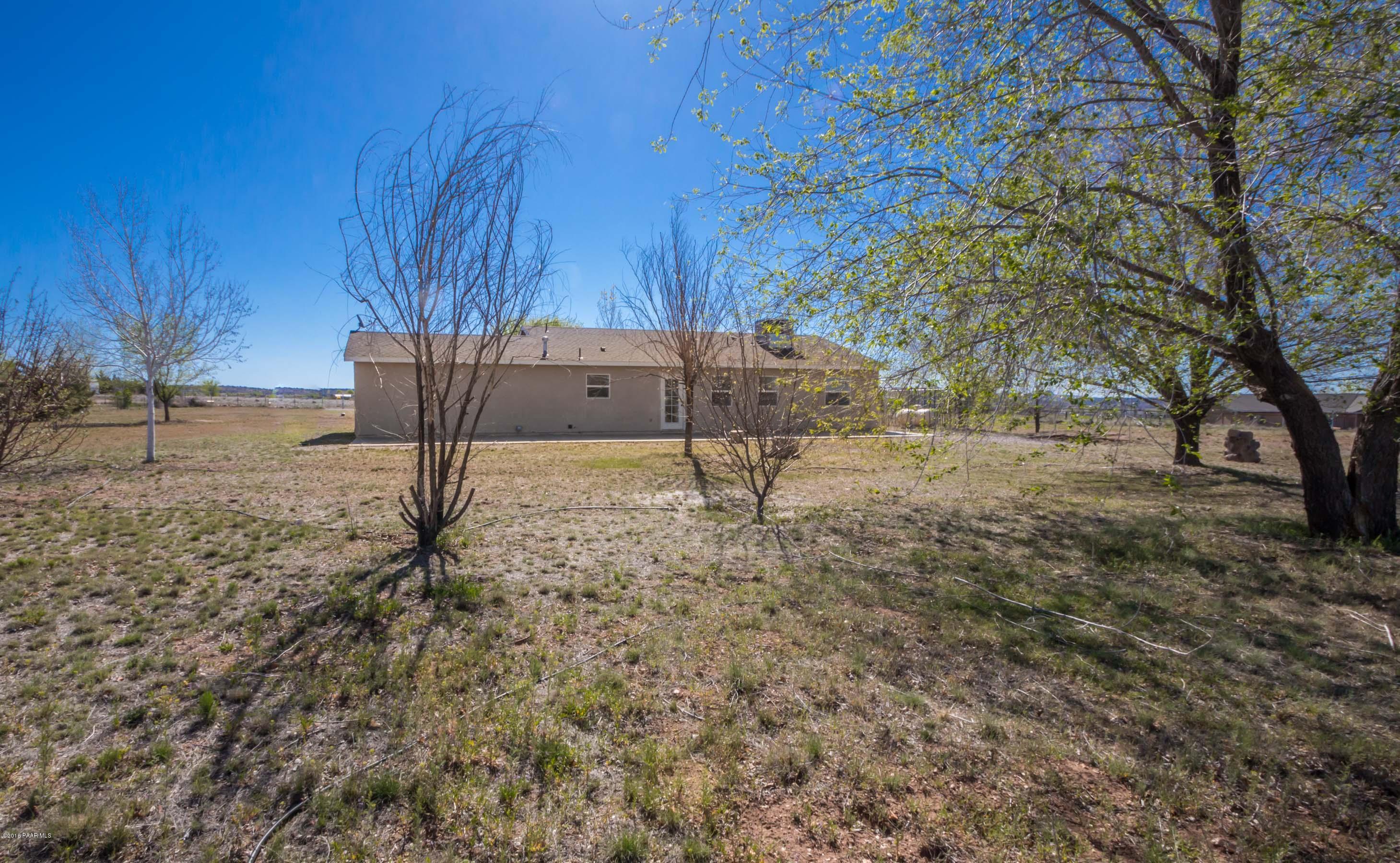 25800 Poppy Road Paulden, AZ 86334 - Photo 15 of 15 a backyard of a house with lots of green space