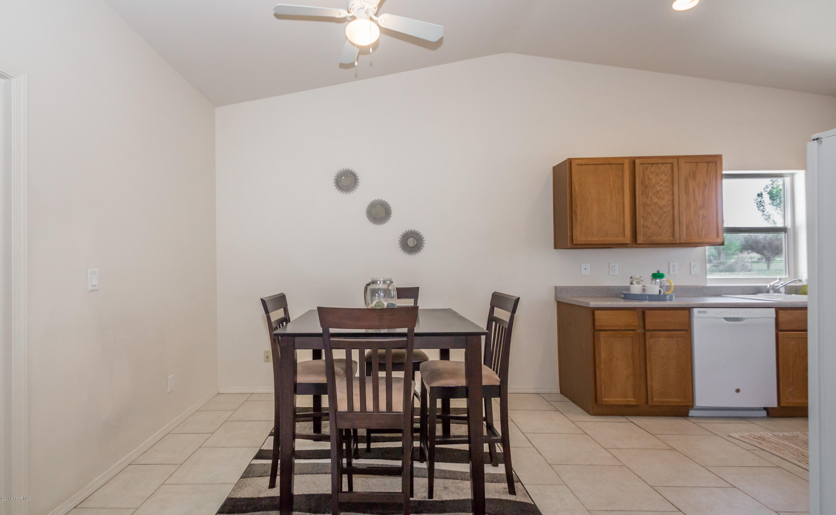 25800 Poppy Road Paulden, AZ 86334 - Photo 4 of 15 a view of a kitchen with a table and chairs