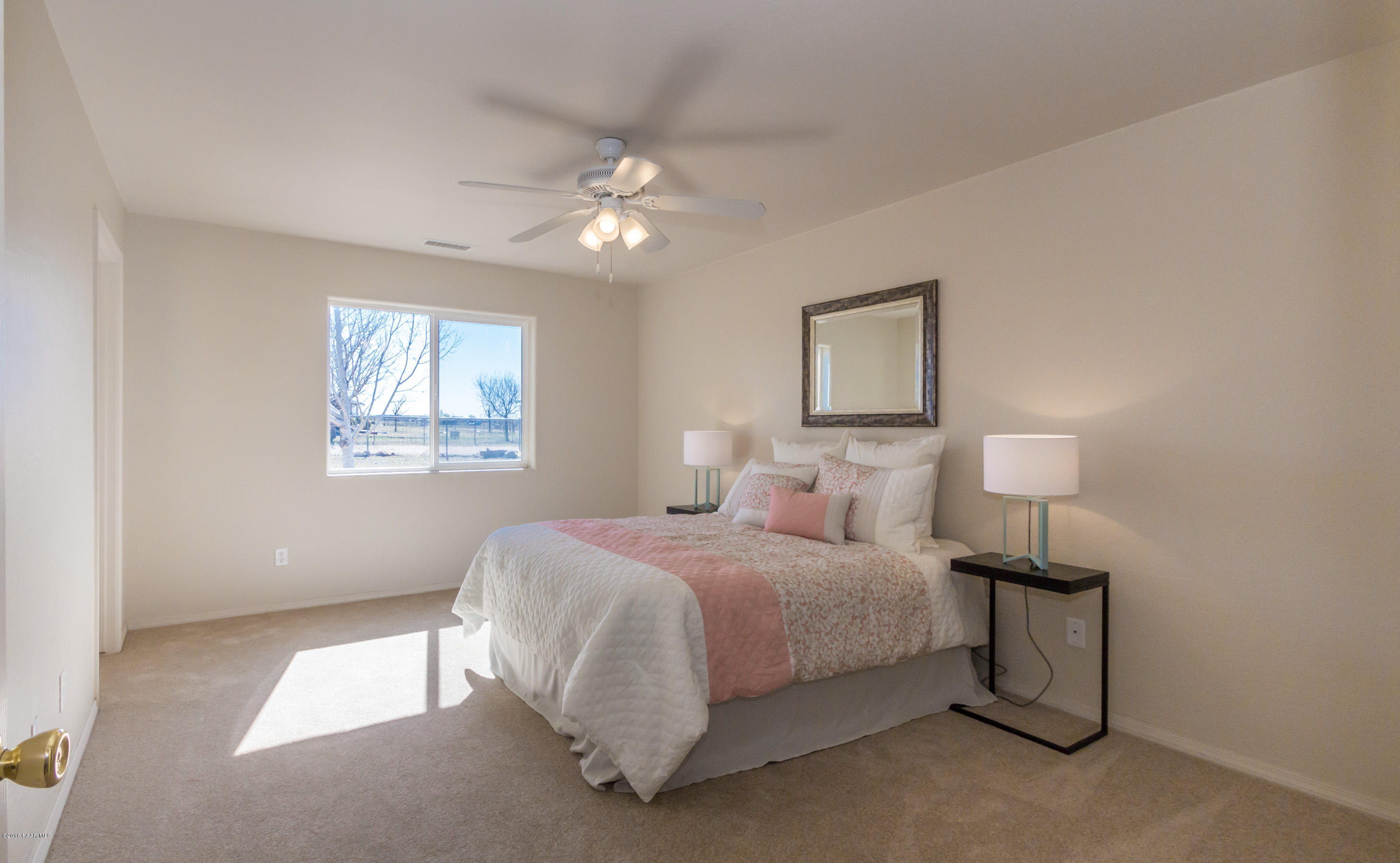 25800 Poppy Road Paulden, AZ 86334 - Photo 5 of 15 a bedroom with a bed and a lamp