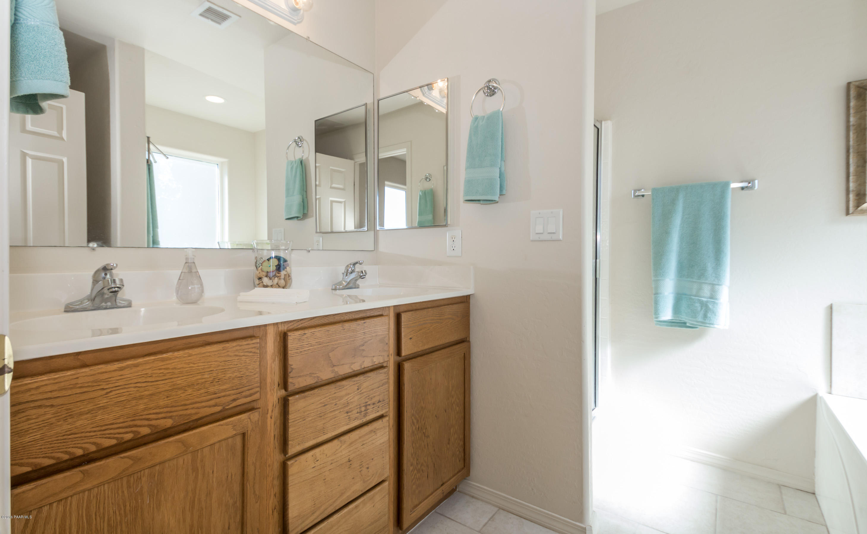 25800 Poppy Road Paulden, AZ 86334 - Photo 6 of 15 a bathroom with a sink and a mirror