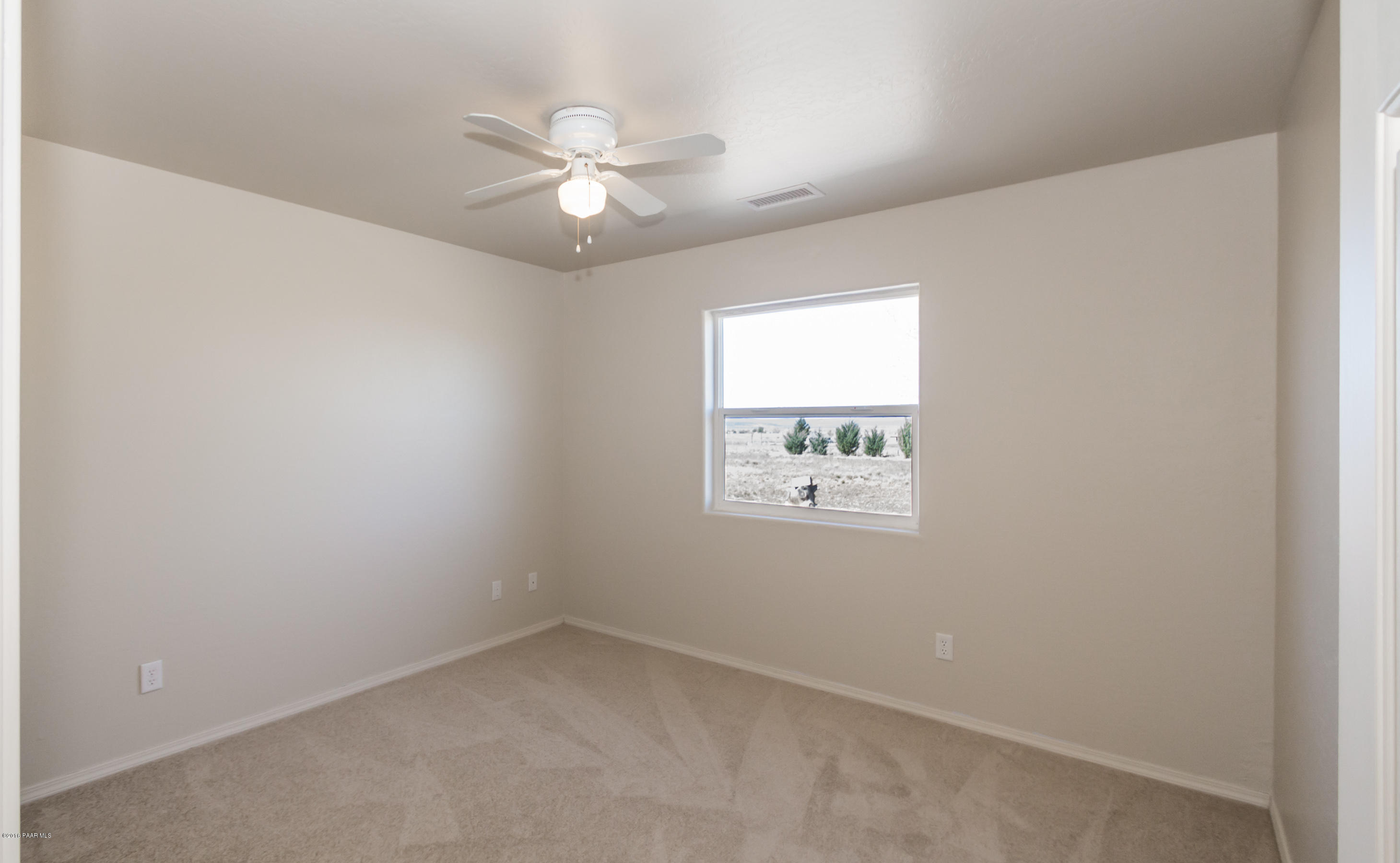 25800 Poppy Road Paulden, AZ 86334 - Photo 10 of 15 an empty room with windows and fan