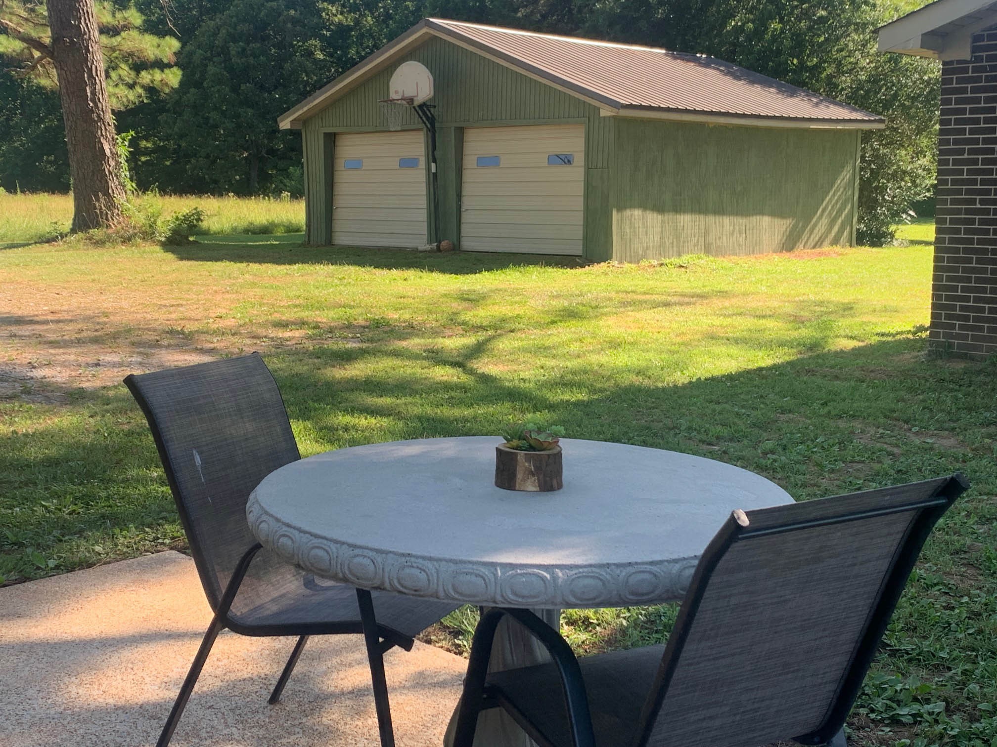 18 Elora Road Flintville, TN 37335 - Photo 7 of 11 a view of a patio with table and chairs under an umbrella
