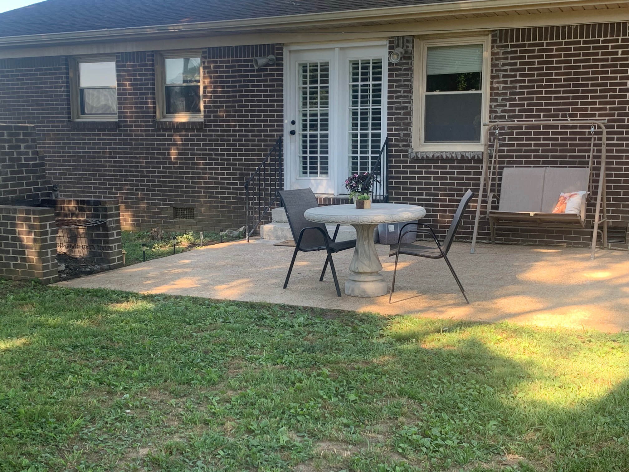 18 Elora Road Flintville, TN 37335 - Photo 9 of 11 a backyard of a house with table and chairs