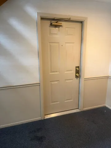 an empty room with an empty door