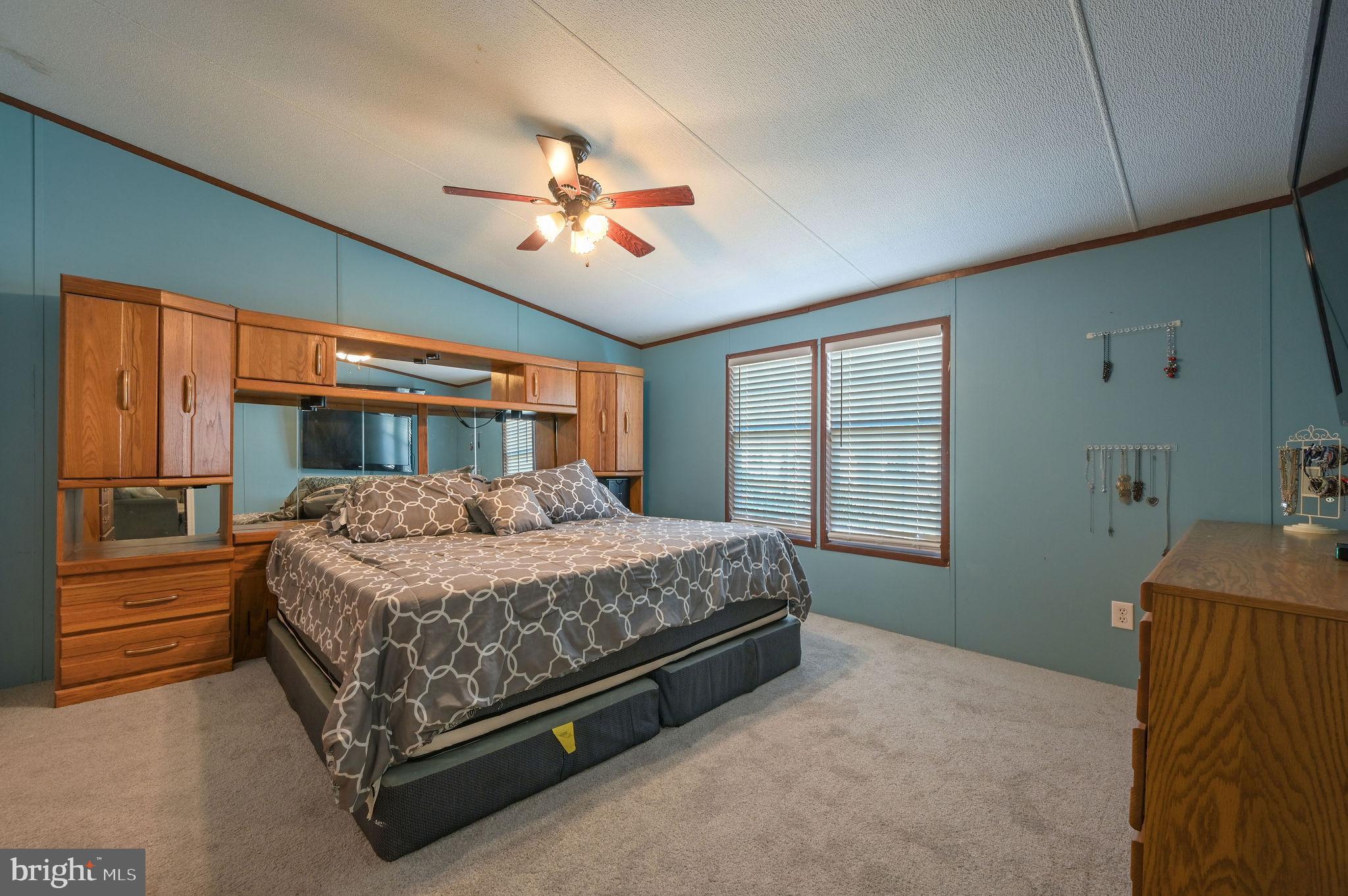 33 Hedgerow Hollow Road, Unit 33 Smyrna, DE 19977 - Photo 11 of 20 a bedroom with a bed dresser and a window