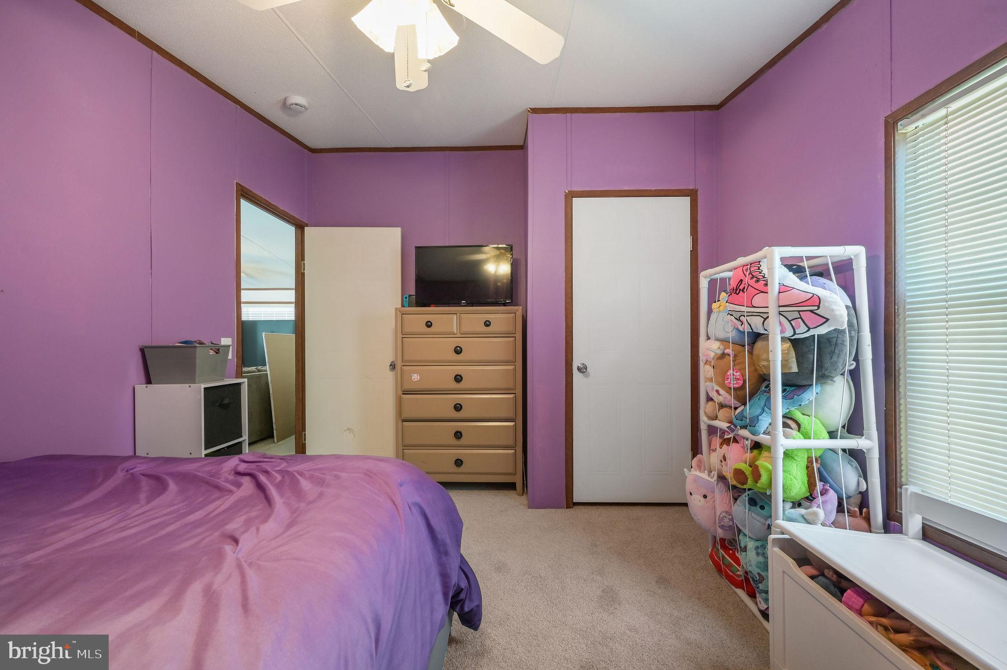 33 Hedgerow Hollow Road, Unit 33 Smyrna, DE 19977 - Photo 16 of 20 a bedroom with a bed and a mirror