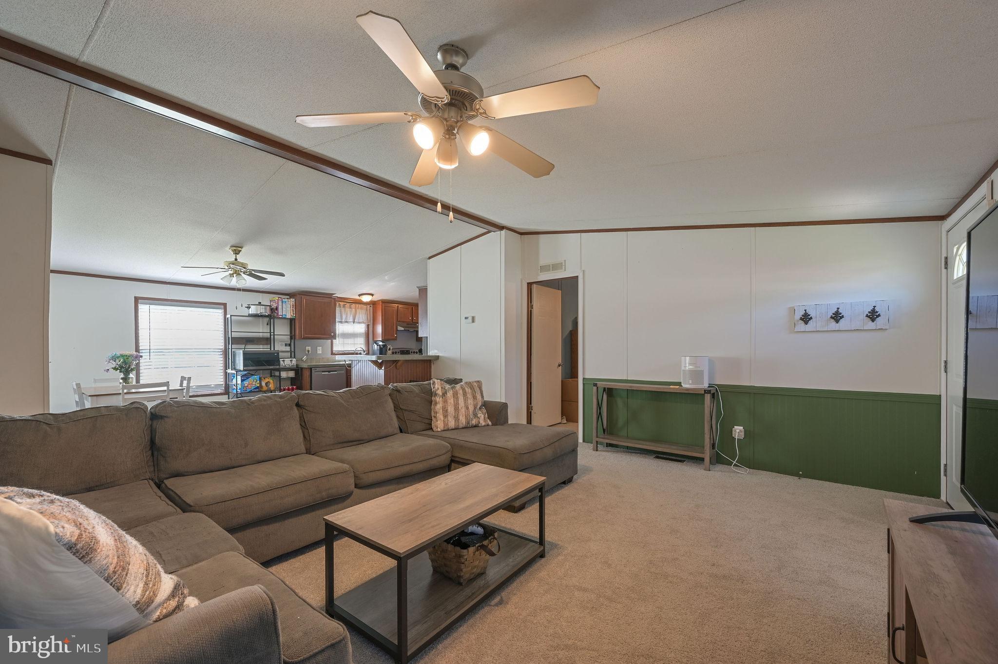 33 Hedgerow Hollow Road, Unit 33 Smyrna, DE 19977 - Photo 5 of 20 a living room with furniture and a wooden floor