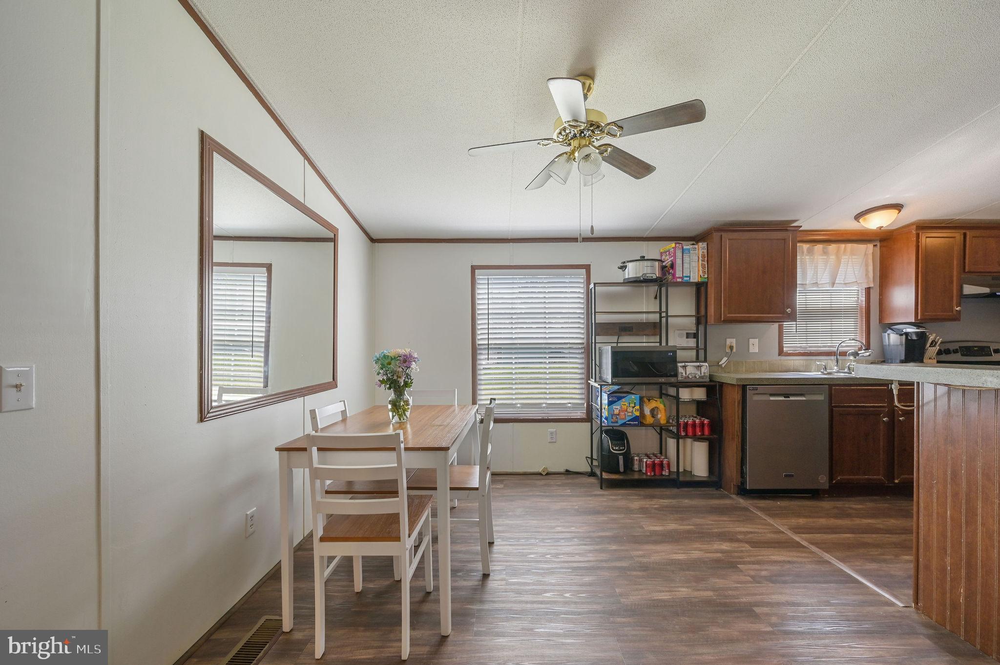 33 Hedgerow Hollow Road, Unit 33 Smyrna, DE 19977 - Photo 6 of 20 a view of a dining room with furniture window and wooden floor