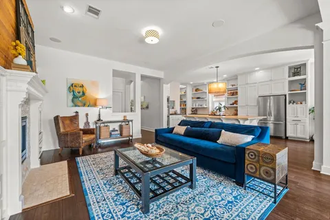 a livingroom with workspace and a couch