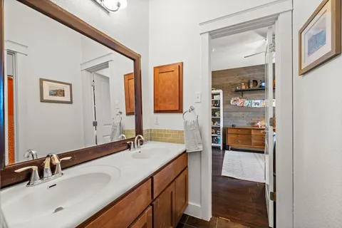 a bedroom with furniture and a wooden floor