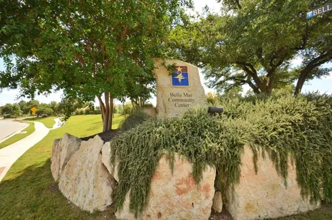 a swimming pool with outdoor seating and yard