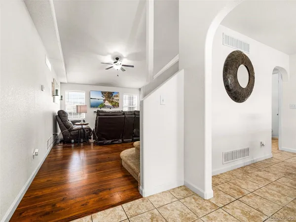 a living room with furniture and a table