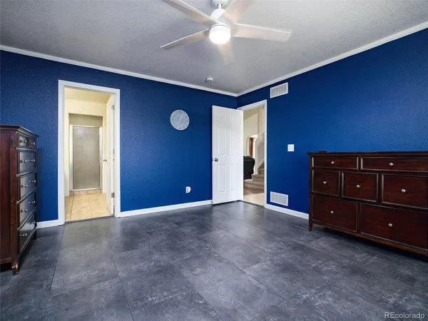 a view of an empty room with cabinet and flat screen tv