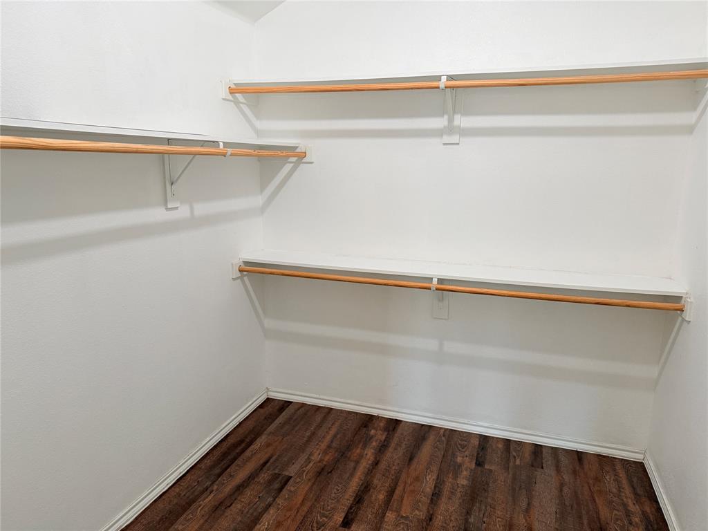 1117 Bent Tree Road Royse City, TX 75189 - Photo 11 of 22 Spacious closet featuring dark wood-style floors