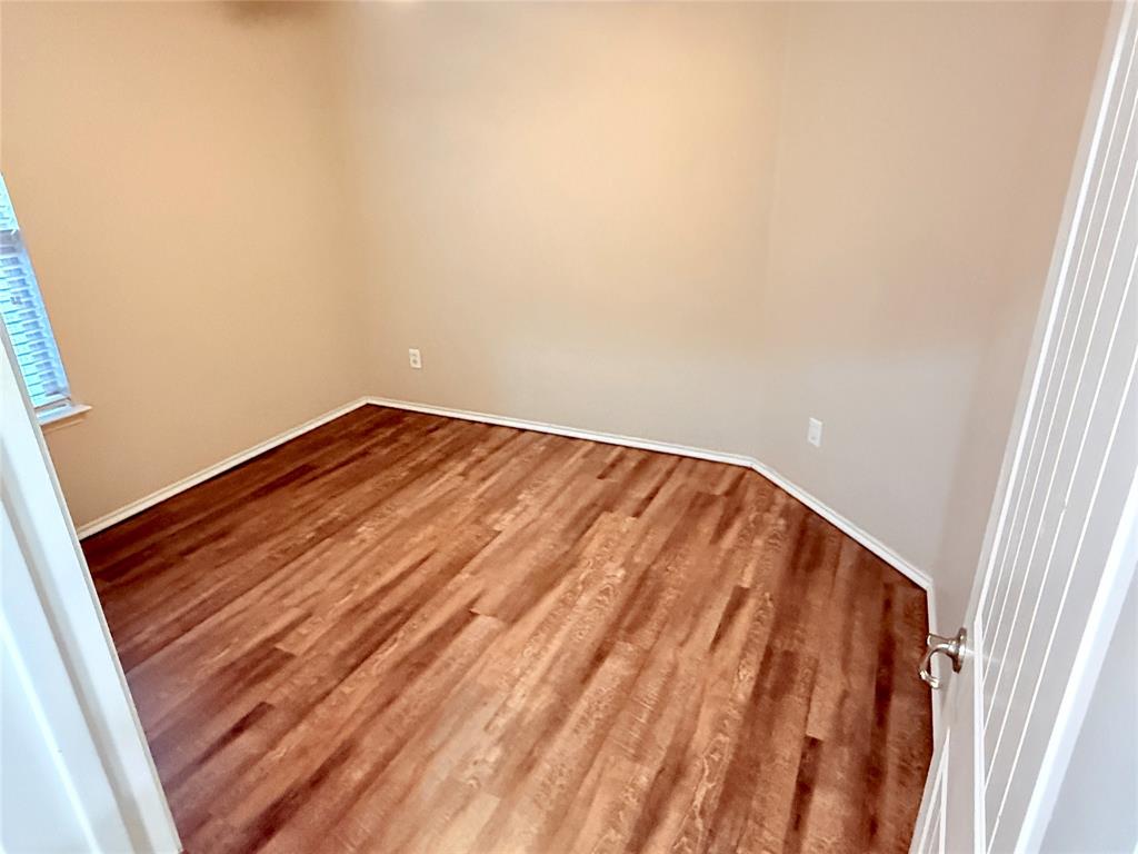 1117 Bent Tree Road Royse City, TX 75189 - Photo 13 of 22 Spare room with wood finished floors and baseboards