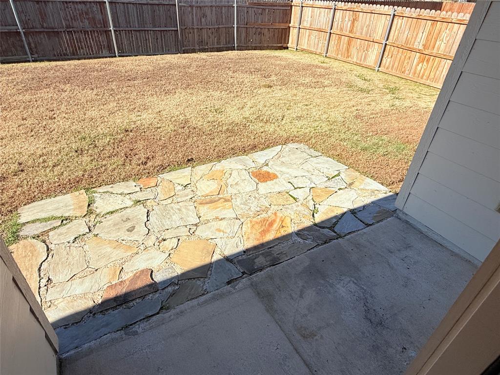 1117 Bent Tree Road Royse City, TX 75189 - Photo 16 of 22 Fenced backyard with a patio area