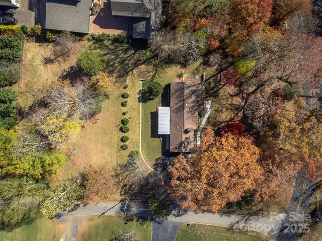 an aerial view of house with yard