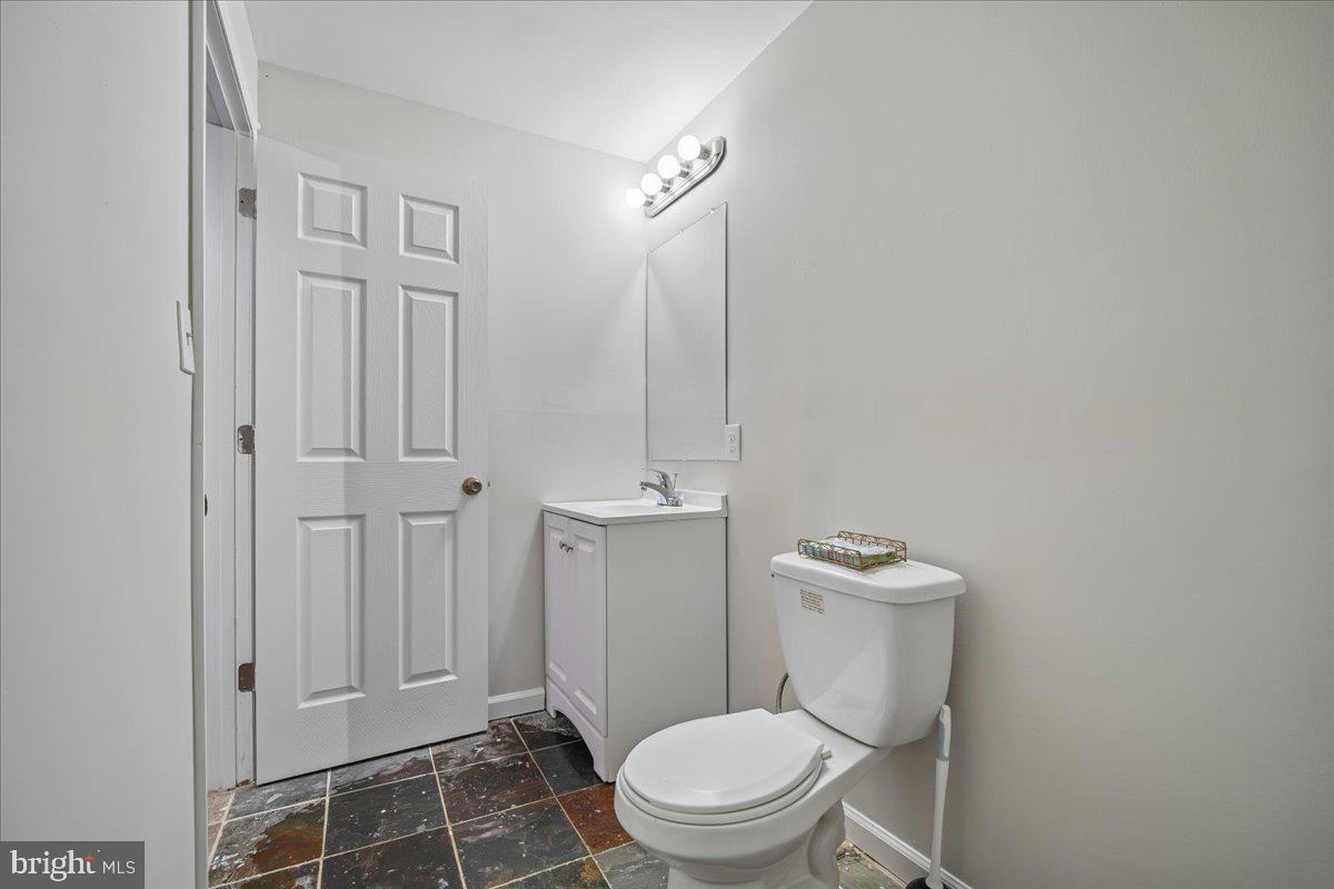 1112 Ryon Way District Heights, MD 20747 - Photo 48 of 63 a white toilet sitting next to a bathroom sink
