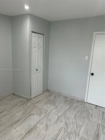 a bathroom with a shower and a tub
