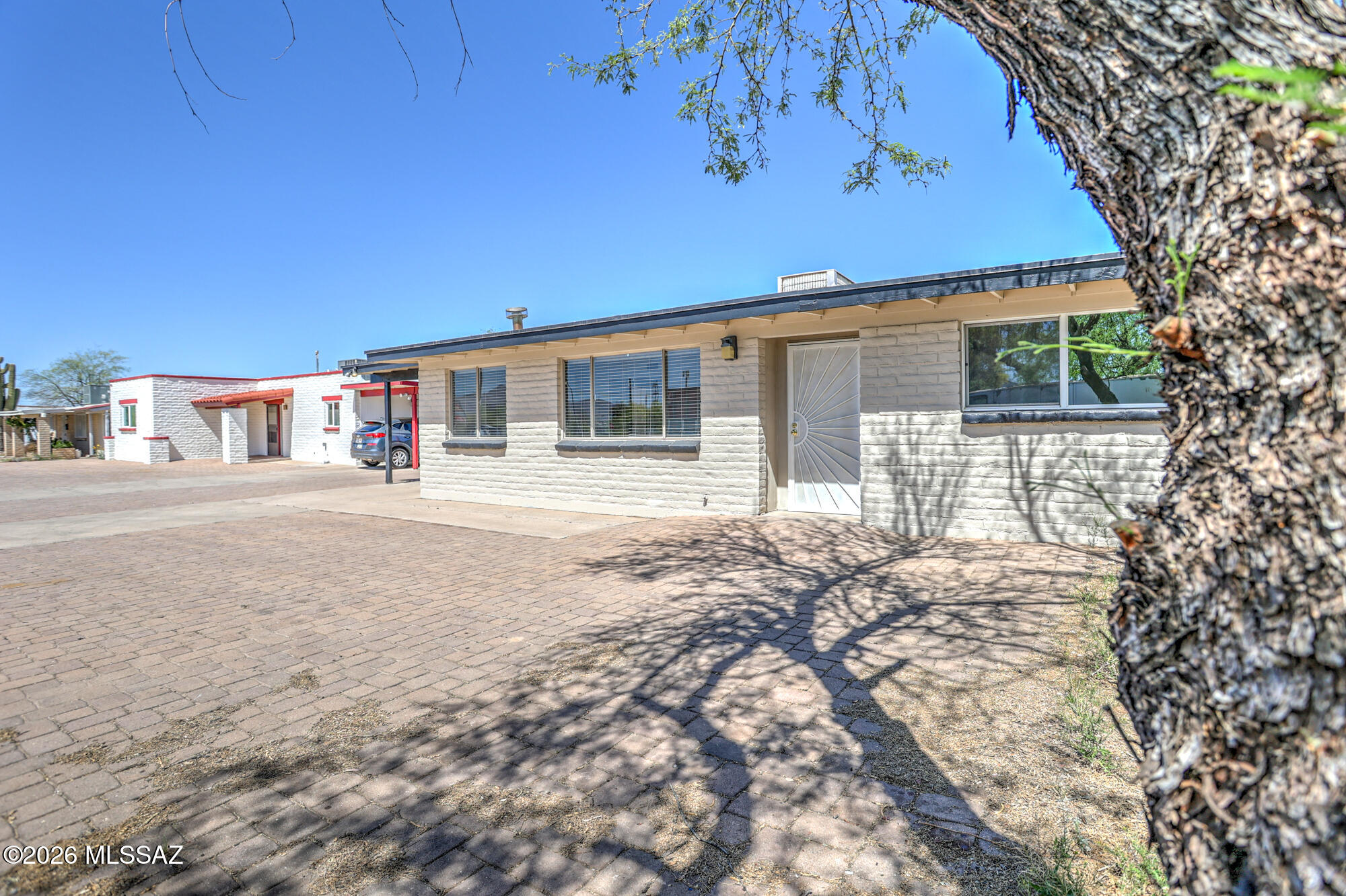 4400 West Ina Road Tucson, AZ 85741 - Photo 11 of 43 a backyard of a house with barbeque oven and outdoor seating