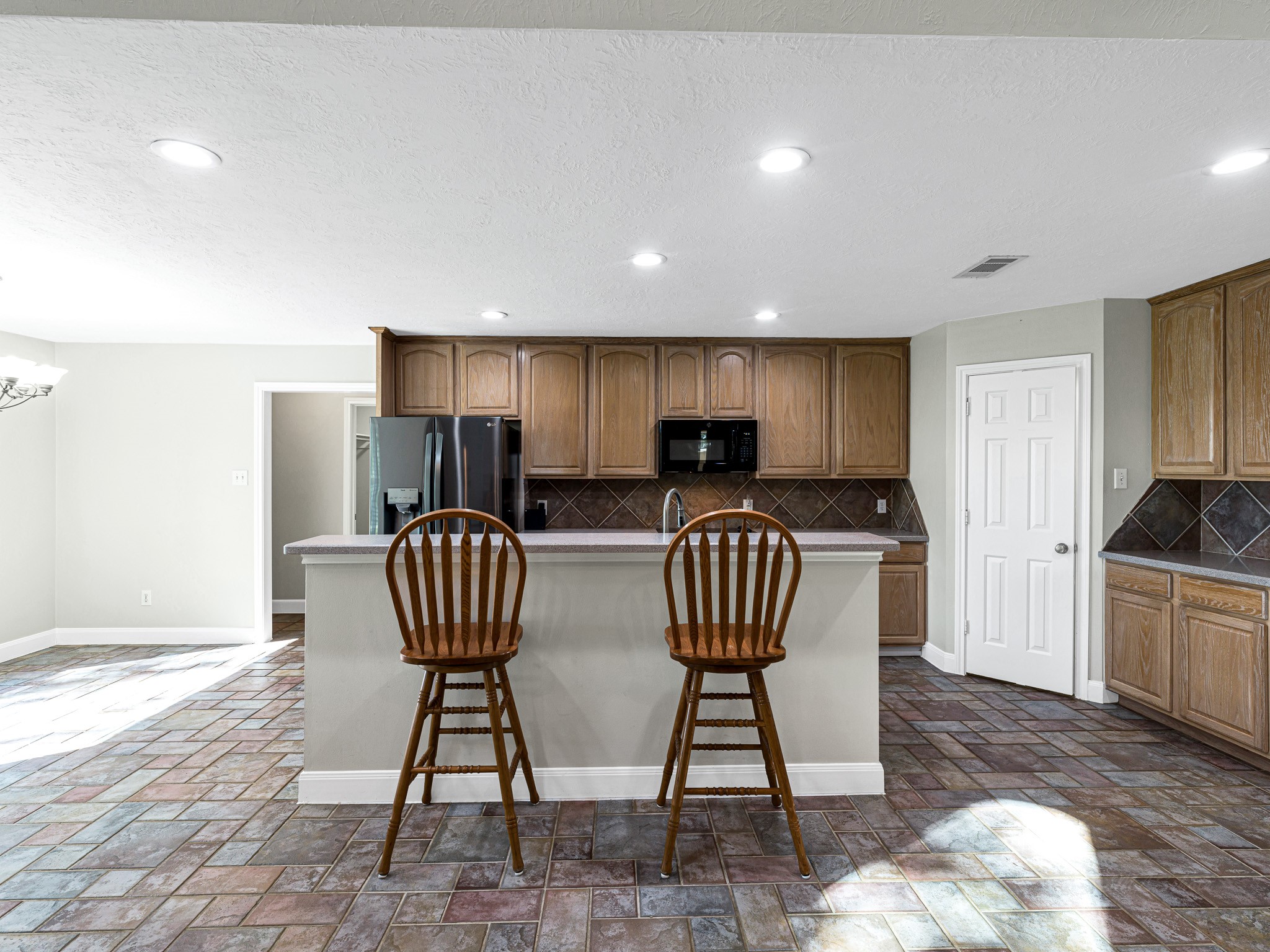 32601 Rogers Road Fulshear, TX 77441 - Photo 18 of 50 You'll never miss a conversation while cooking and entertaining in this open concept kitchen with huge walk-in pantry.