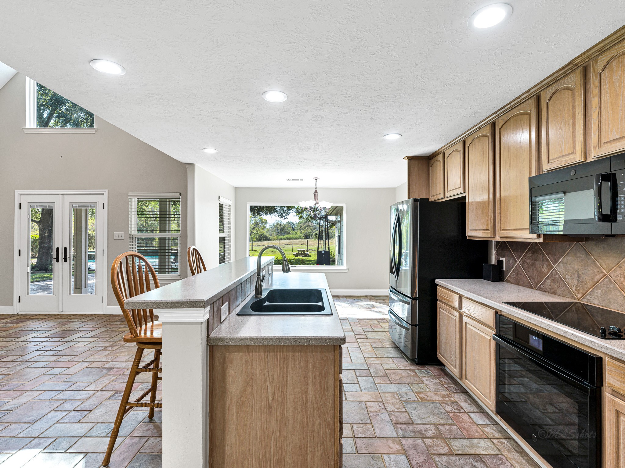32601 Rogers Road Fulshear, TX 77441 - Photo 19 of 50 Create lasting memories in this kitchen open to the family room...TONS of cabinets!