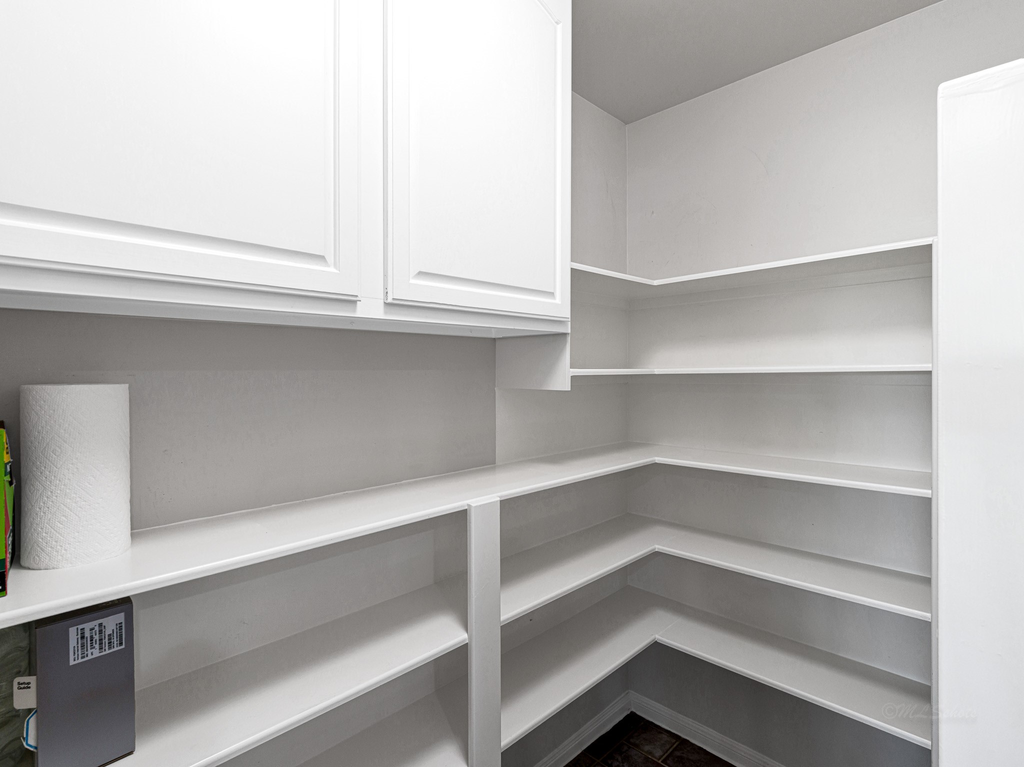 32601 Rogers Road Fulshear, TX 77441 - Photo 21 of 50 This pantry has tons of shelves and cabinets for you to store all your beverages or snacks in!