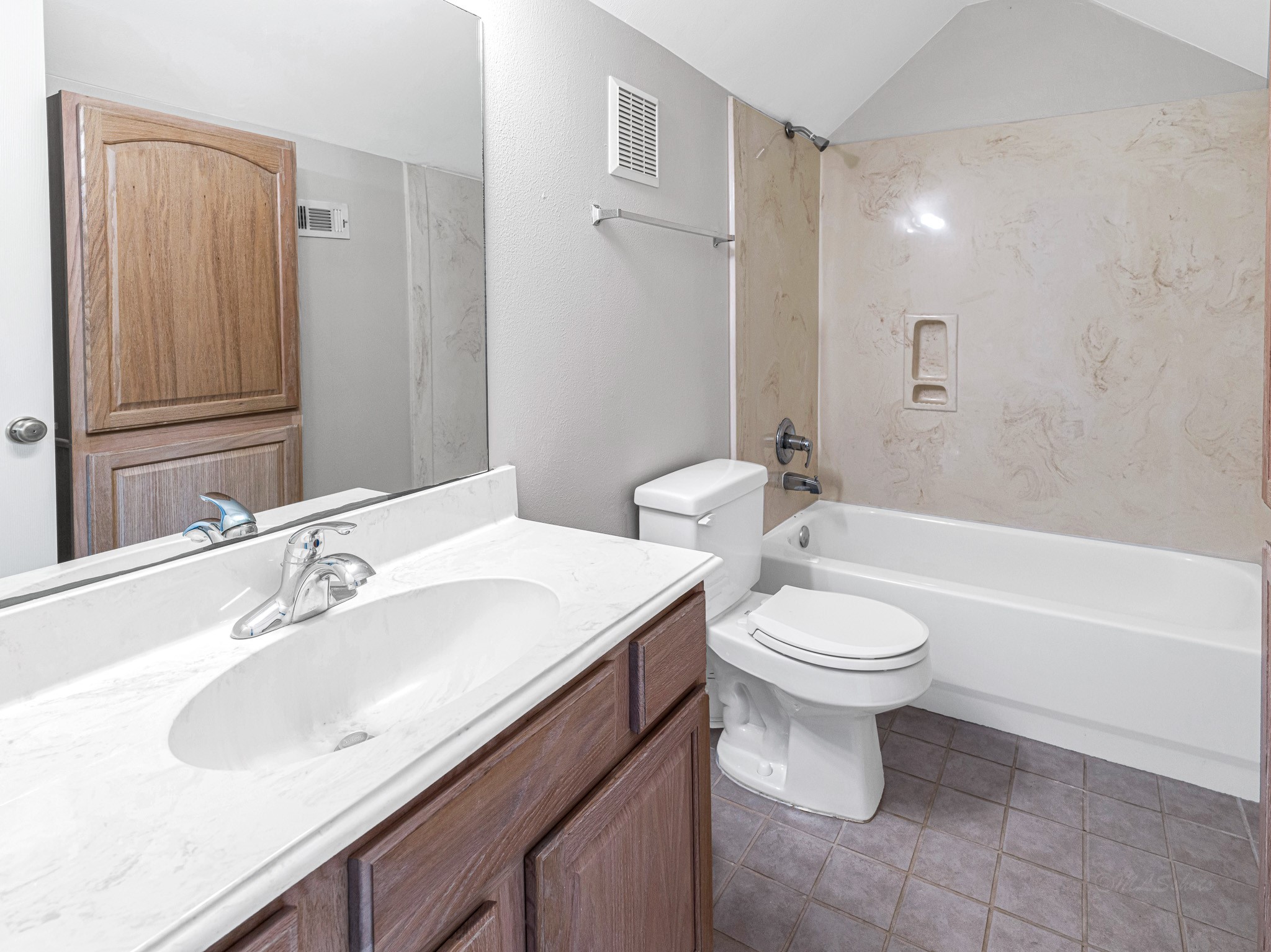 32601 Rogers Road Fulshear, TX 77441 - Photo 38 of 50 The spacious upstairs bathroom has a linen closet and marble slab shower surround.