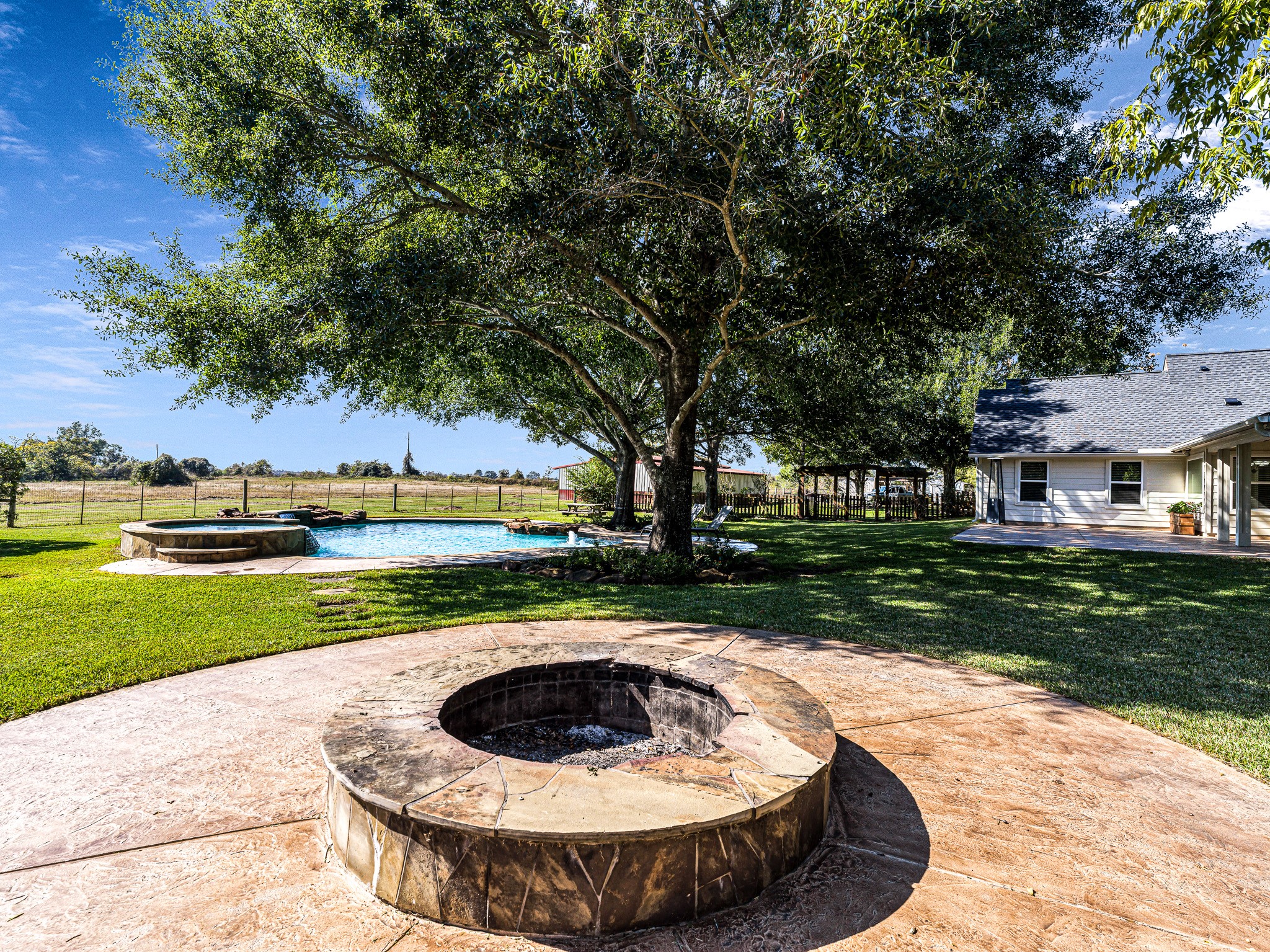 32601 Rogers Road Fulshear, TX 77441 - Photo 44 of 50 Let's sit around the builtin fire pit and roast some s'mores!