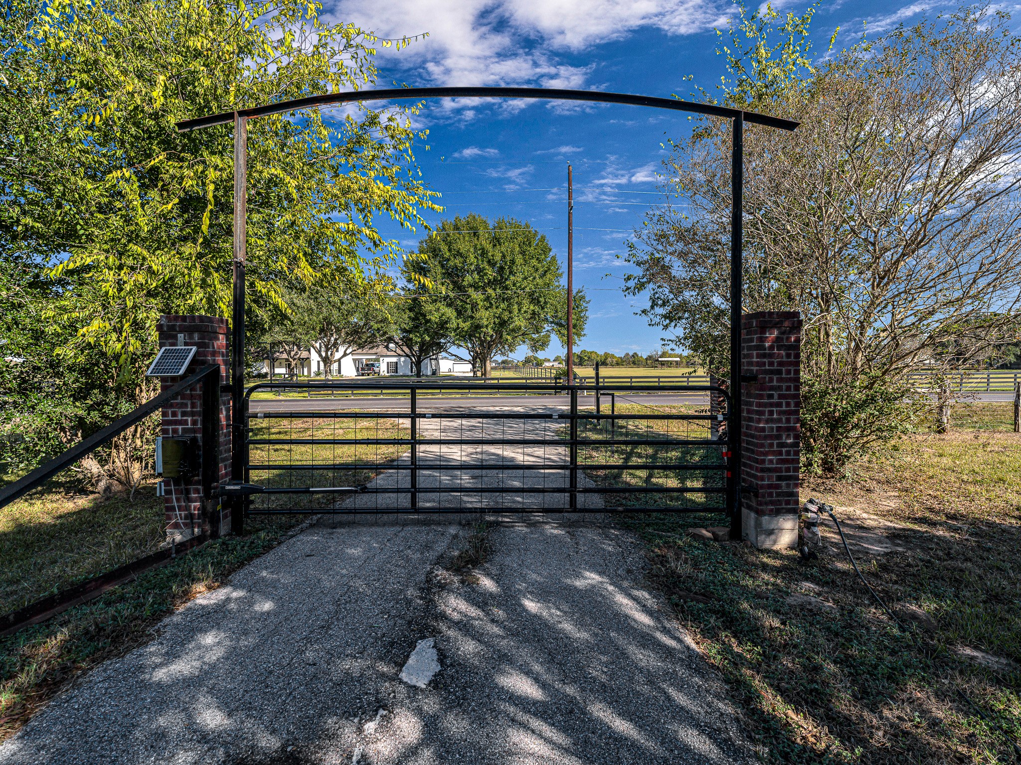 32601 Rogers Road Fulshear, TX 77441 - Photo 5 of 50 This automatic gate is the doorway to 10 lush acres and provides privacy for this incredible property.