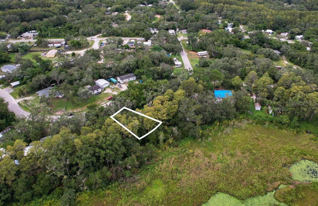 36 Poplar Street New Port Richey, FL 34654 - Photo 3 of 12 an aerial view of a house with yard