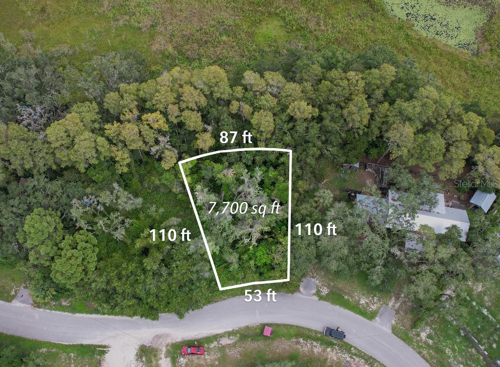 36 Poplar Street New Port Richey, FL 34654 - Photo 6 of 12 a view of a sign in a garden