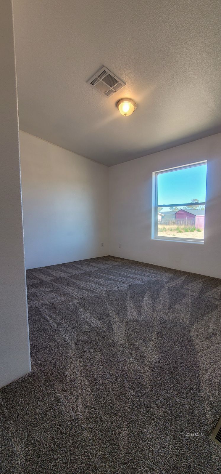 1056 North Alford Street Ridgecrest, CA 93555 - Photo 10 of 24 an empty room with a empty space and windows