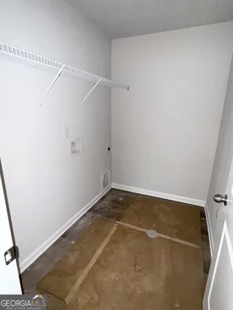 a kitchen with a sink cabinets and utility