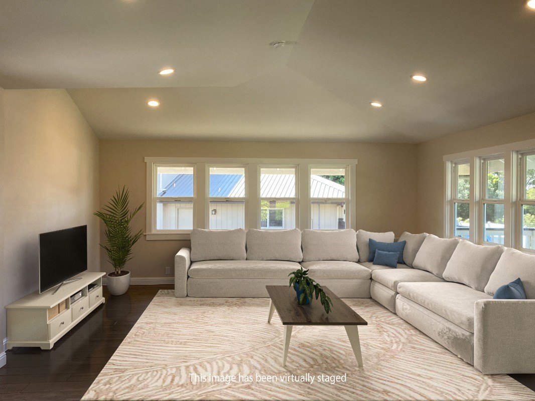 66-1515 Kawaihae Road Kamuela, HI 96743 - Photo 6 of 20 a living room with furniture and a flat screen tv