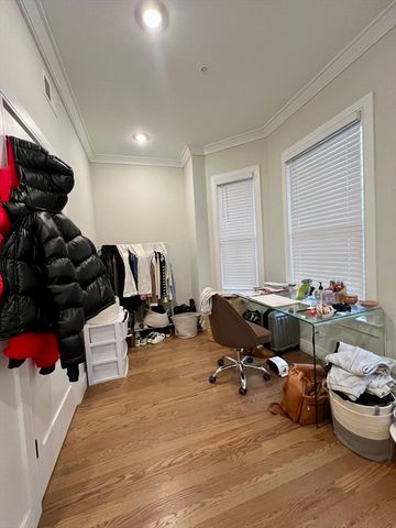 a bathroom with a toilet sink and shower