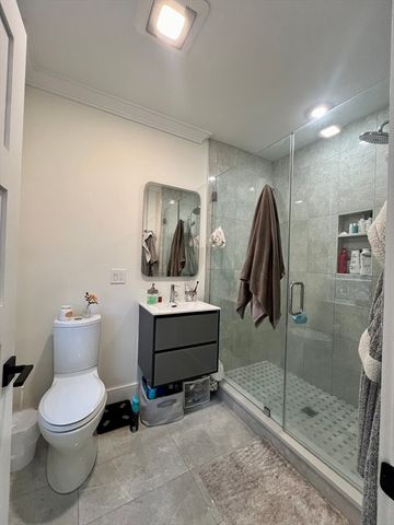 a bedroom with a bed and a table