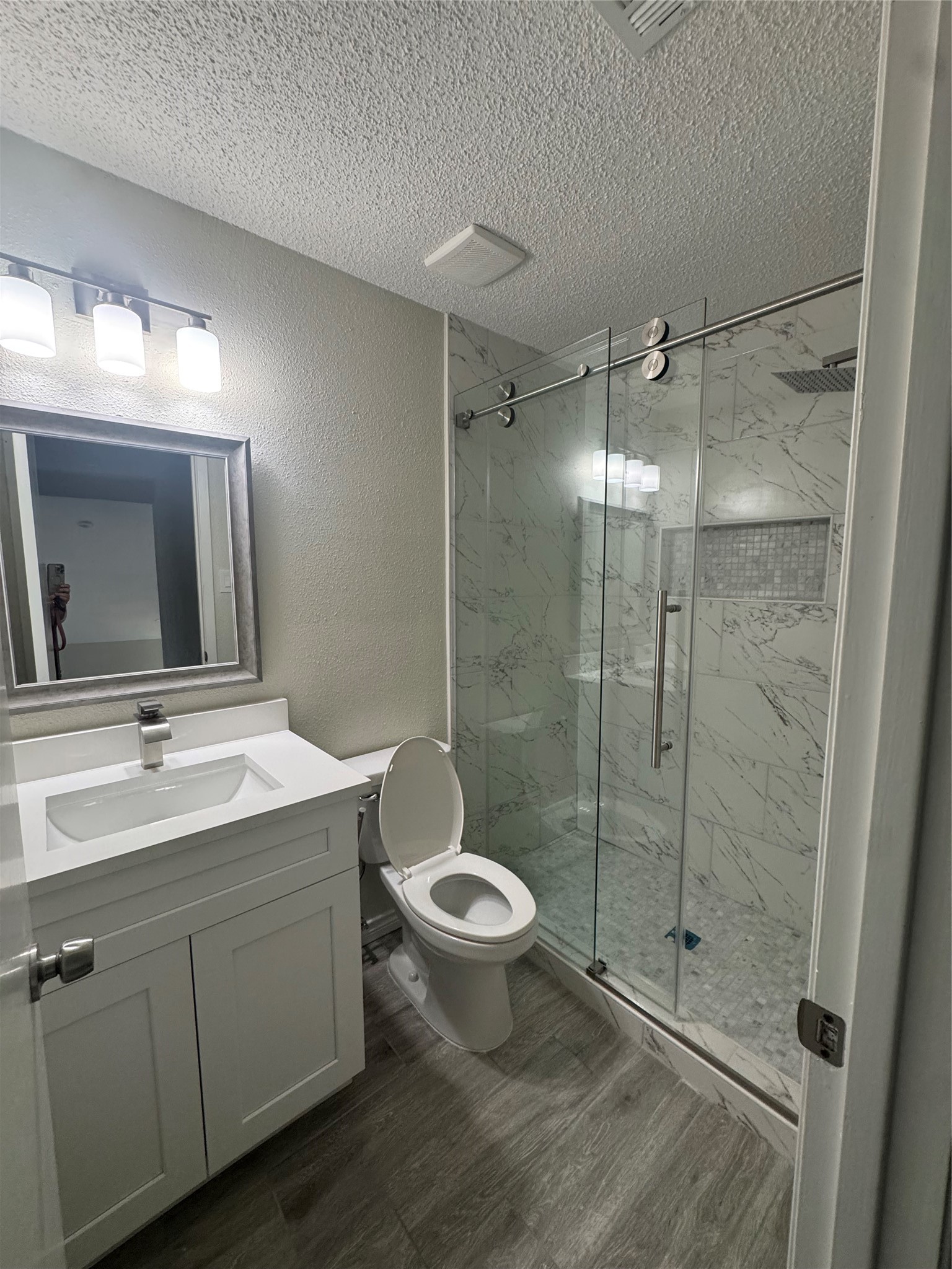 13626 Sunswept Way Houston, TX 77082 - Photo 12 of 30 a bathroom with a toilet sink double vanity and mirror