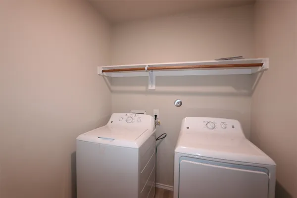 a bathroom with a granite countertop toilet and a shower