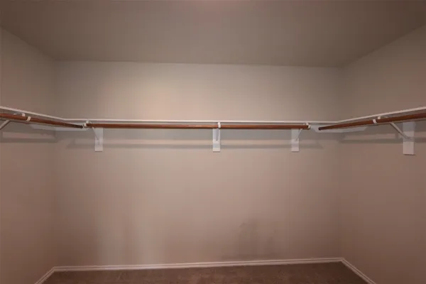 an empty room with a empty space and windows