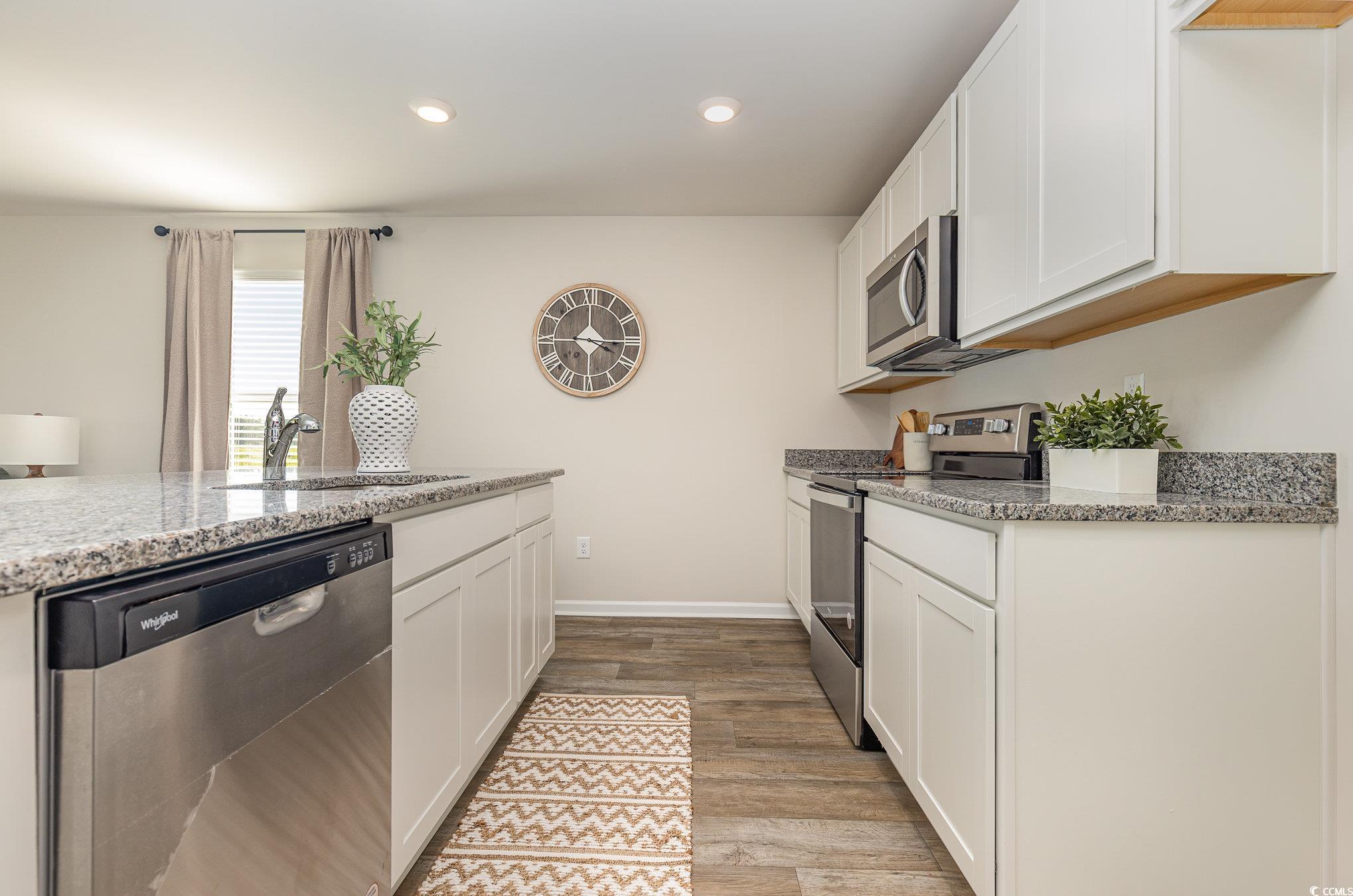 563 Strawberry Fld Way Galivants Ferry, SC 29544 - Photo 4 of 30 Kitchen with stainless steel appliances, light wood-style flooring, white cabinetry, and recessed lighting