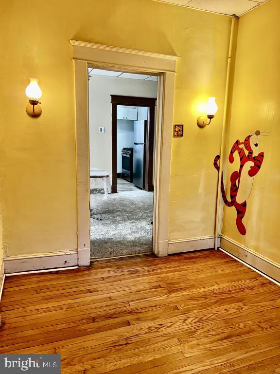 3005 Batavia Avenue Baltimore, MD 21214 - Photo 16 of 26 a view of a livingroom with wooden floor and a bathroom