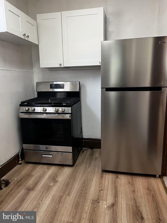 3005 Batavia Avenue Baltimore, MD 21214 - Photo 23 of 26 a kitchen with a refrigerator and a stove