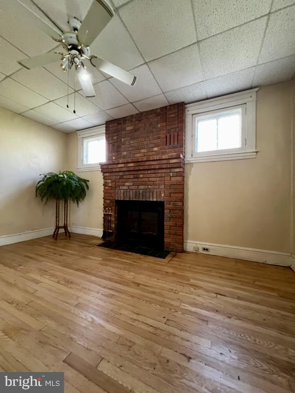 3005 Batavia Avenue Baltimore, MD 21214 - Photo 26 of 26 a view of an empty room with a fireplace and a chandelier fan